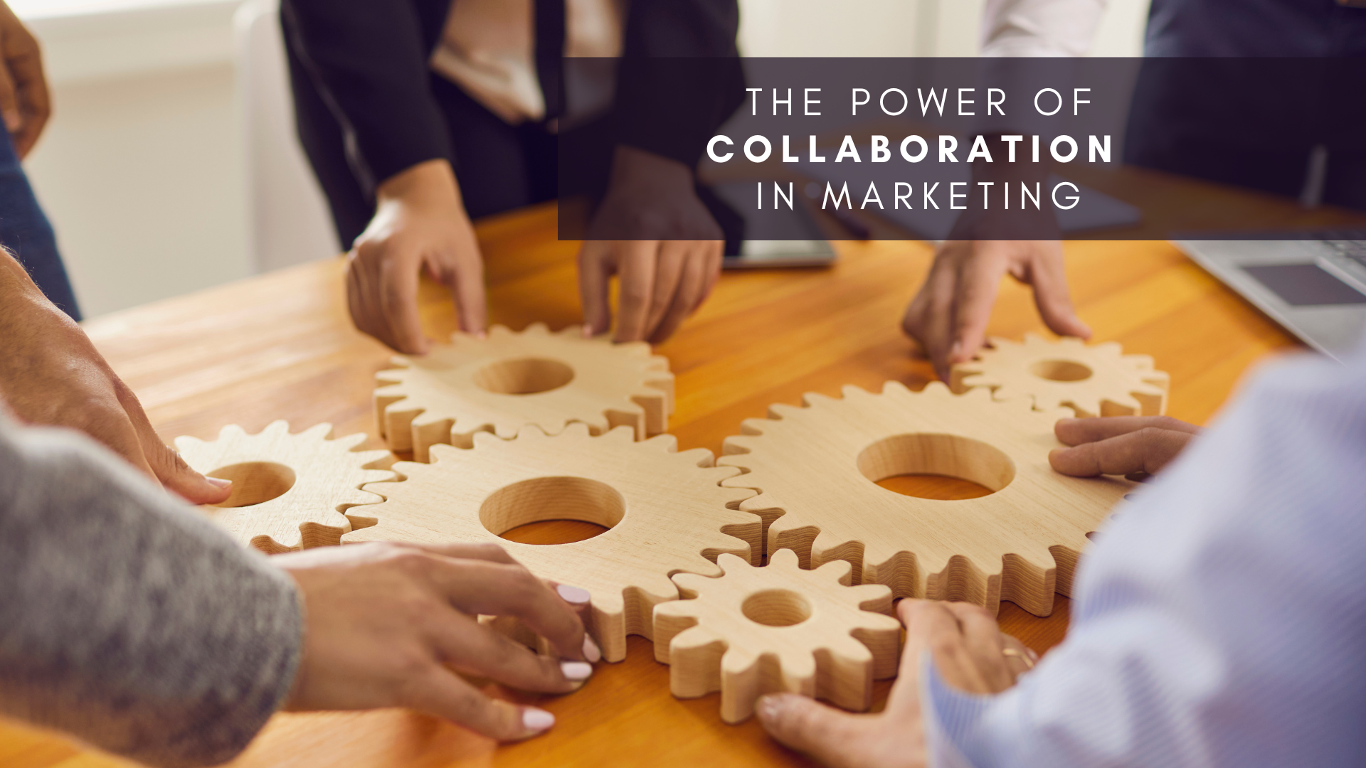 a photo of wooden gears with a group of people standing around it with the title of the article written over it